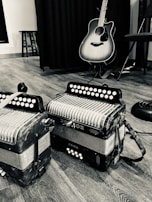 Close-up black and white shot of musical instruments arranged artistically.