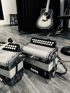 Close-up black and white shot of musical instruments arranged artistically.