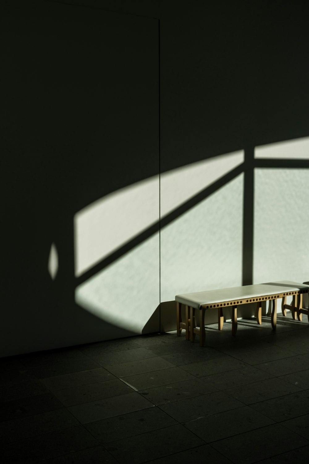 a bench sitting in the middle of a room