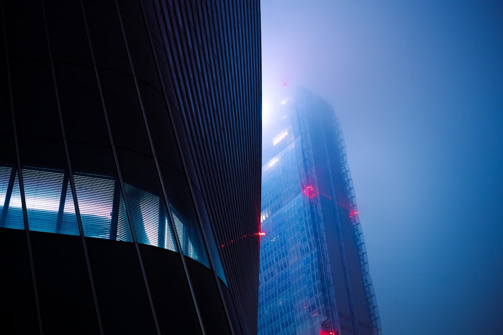 a tall building with a red light on it's side