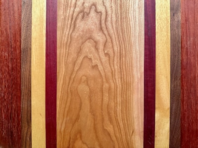a close up of a wooden surface with different colors