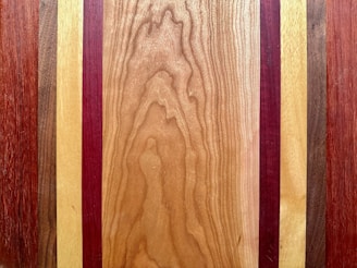 a close up of a wooden surface with different colors