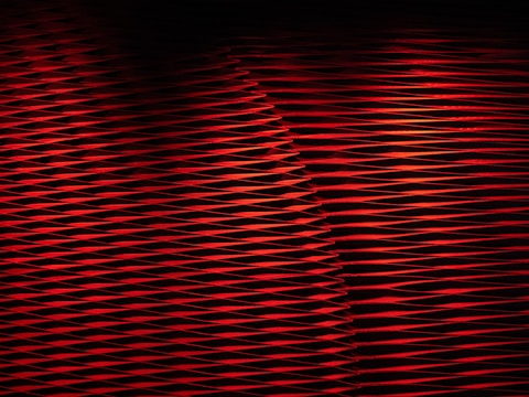 Custom esports jersey featuring red and black color scheme with dynamic patterns.