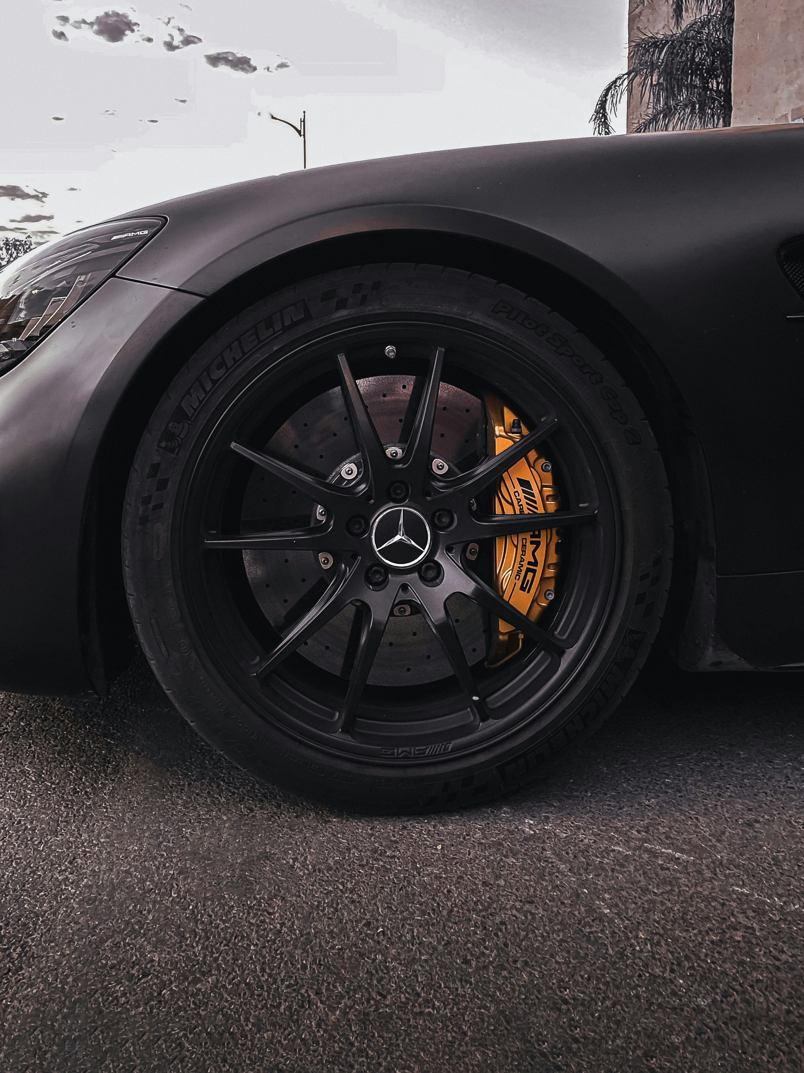a black sports car parked on the side of the road