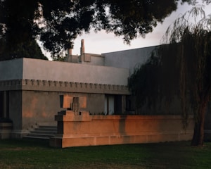 A warmly lit modern building showcasing clean architectural lines and natural materials.