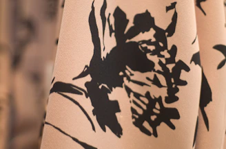 A close-up of a colorful floral print with delicate brushwork and texture.