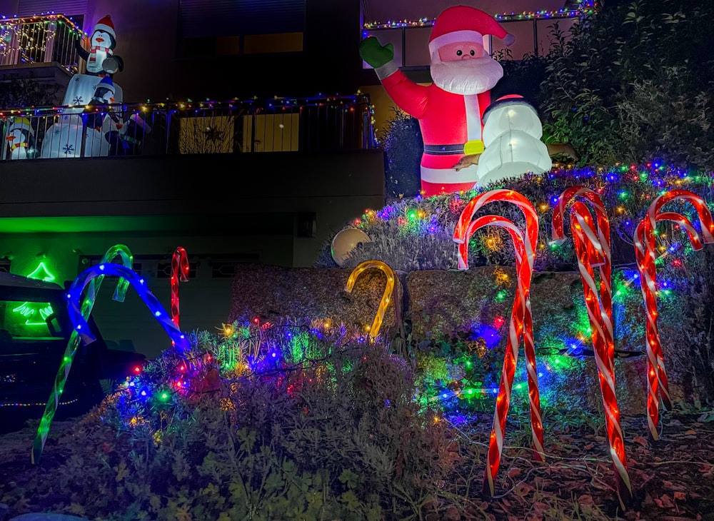 a christmas display with a santa clause and candy canes