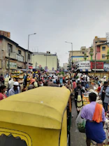 Busy market street scene with rickshaws and vibrant shops in Chandni Chowk, Old Delhi