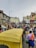 A scenic view of a vibrant Indian market bustling with people.