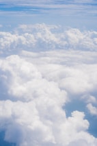 A peaceful scene of guild members strategizing together on floating cloud platforms.