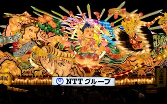 Close-up of colorful traditional artwork displayed at a community event.