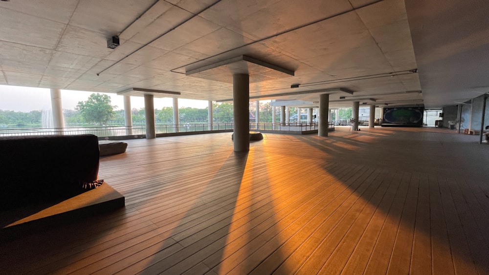 a large room with wooden floors and windows