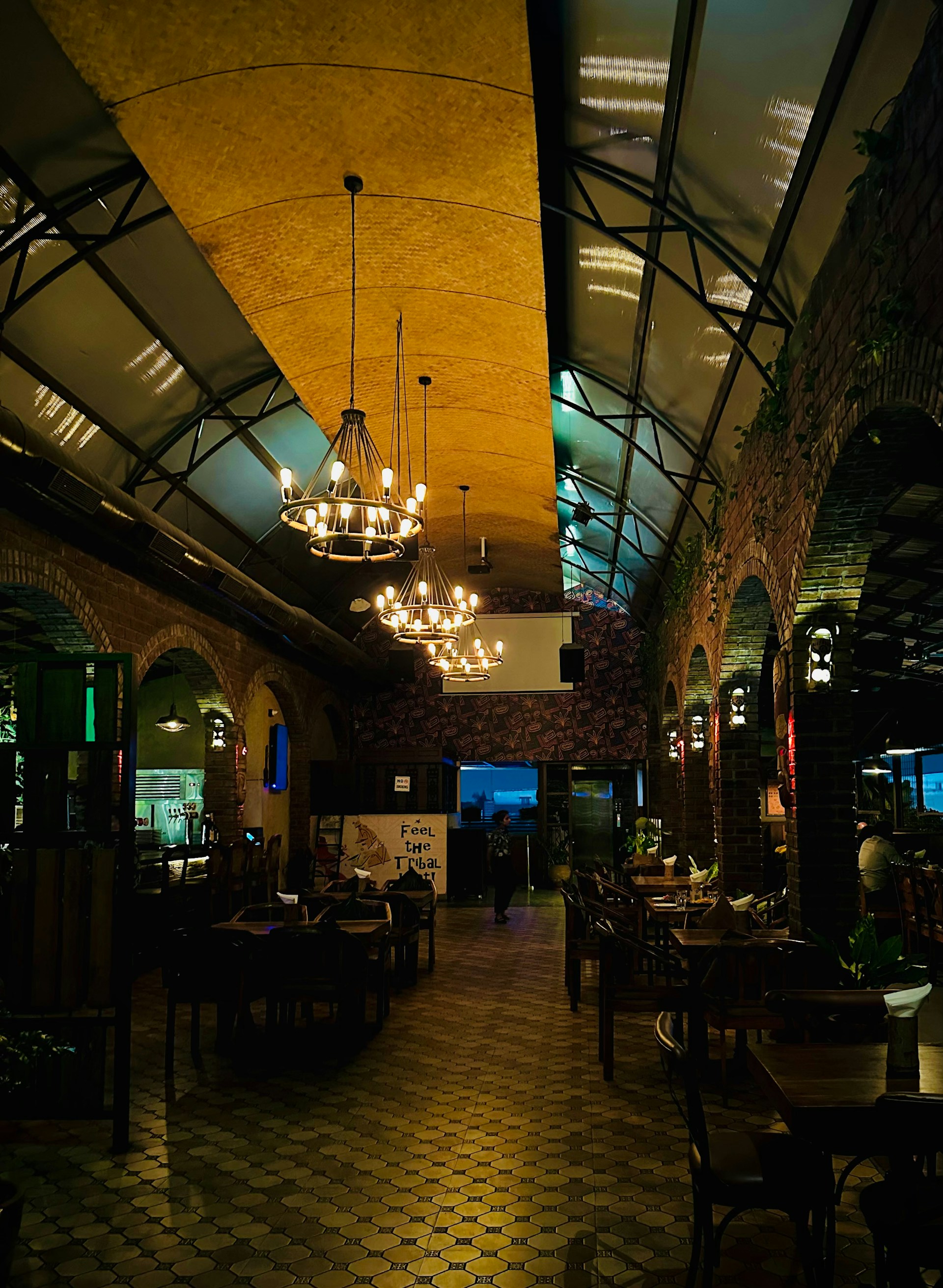 An inviting view of the restaurant interior, featuring warm lighting and rustic decor that reflects a cozy dining atmosphere.