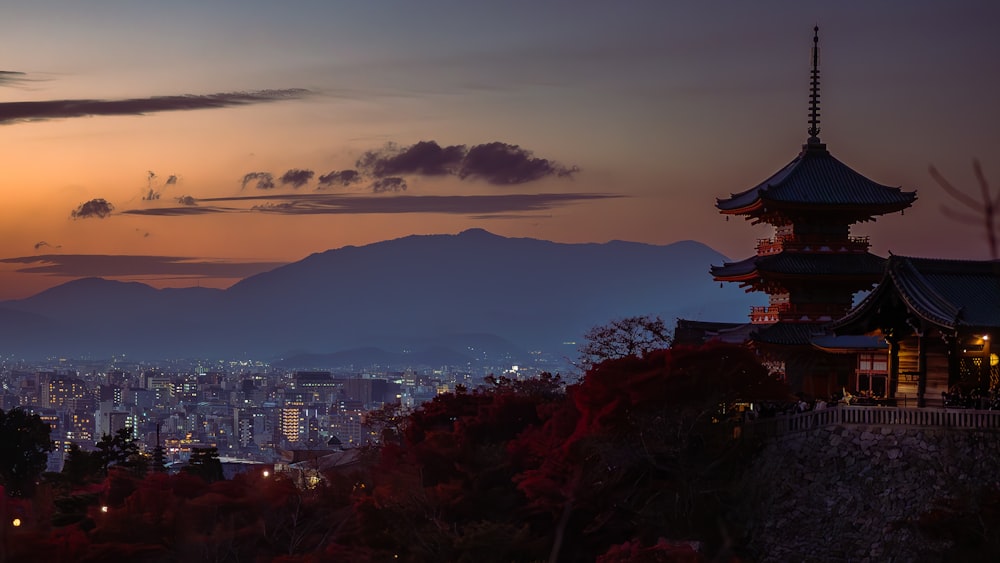 a view of a city at night from a hill