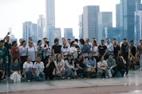 A dynamic group participating in an interactive team-building activity in a modern city venue.