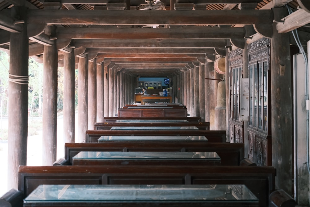 a row of wooden benches sitting next to each other