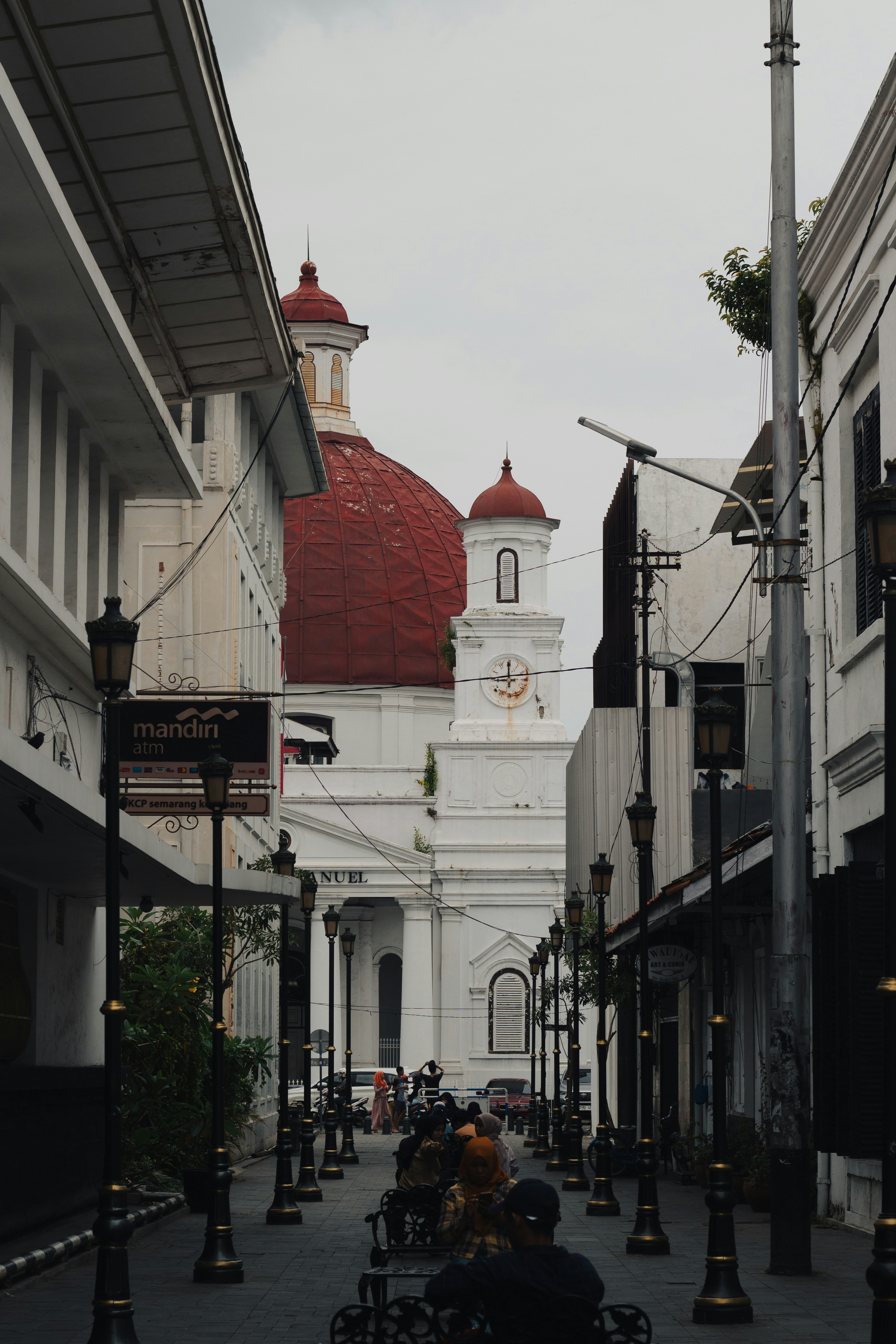 a city street with a church in the background