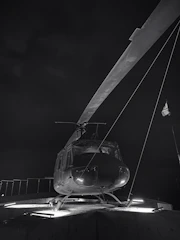 Close-up of a helipad's safety lighting system glowing at dusk.