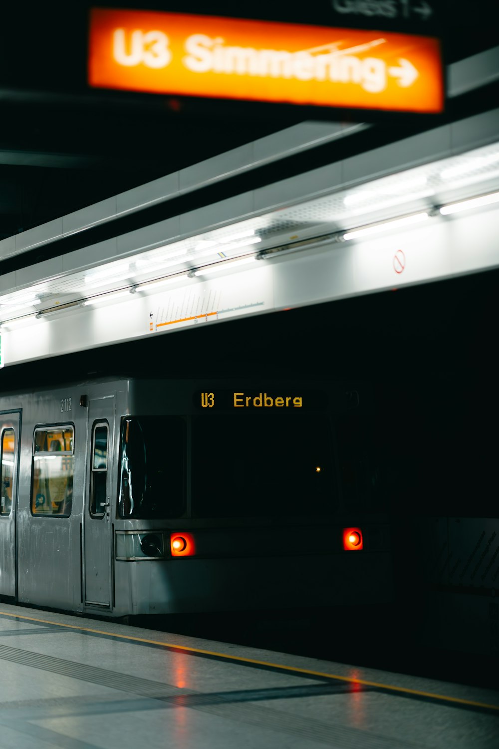 a subway train pulling into a train station