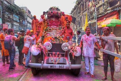 Villagers celebrating a local festival with colorful decorations.