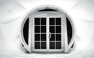 Image of a clean, snow-free walkway leading to a home entrance surrounded by winter snow.