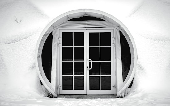 Image of a clean, snow-free walkway leading to a home entrance surrounded by winter snow.