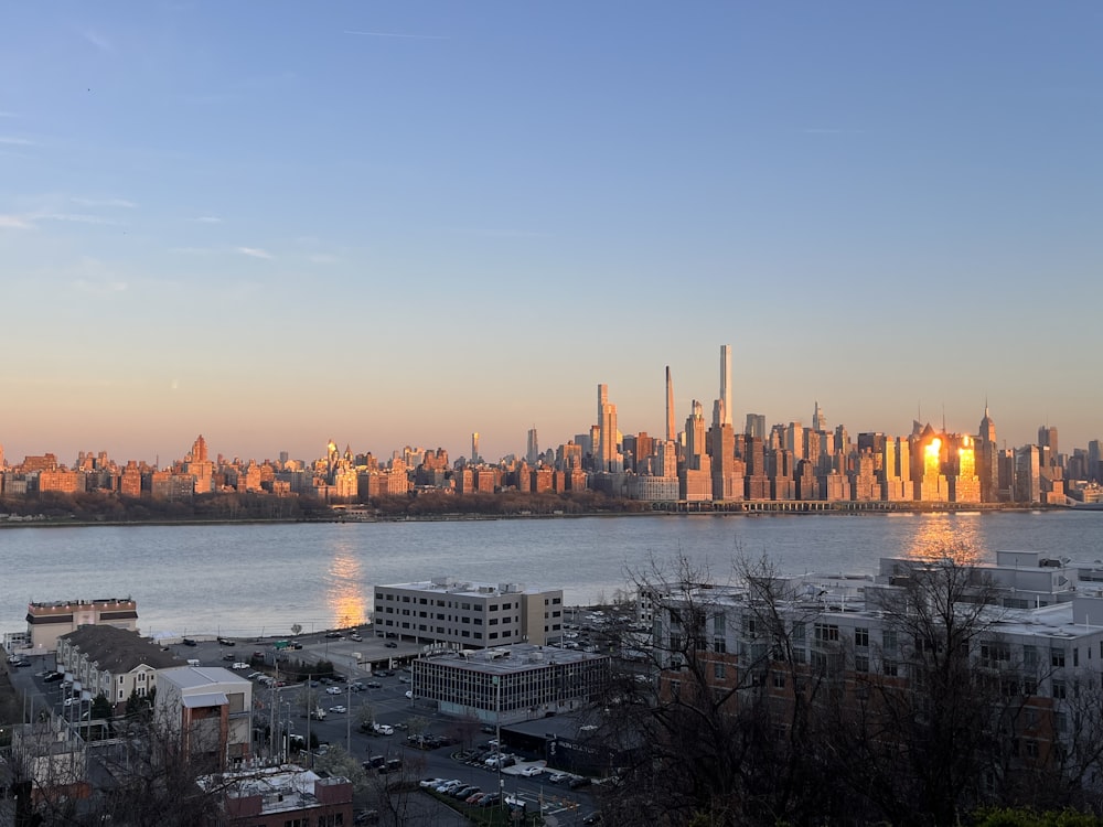 a large body of water with a city in the background