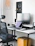 A sleek modern office chair in a bright, airy workspace with African-inspired decor.
