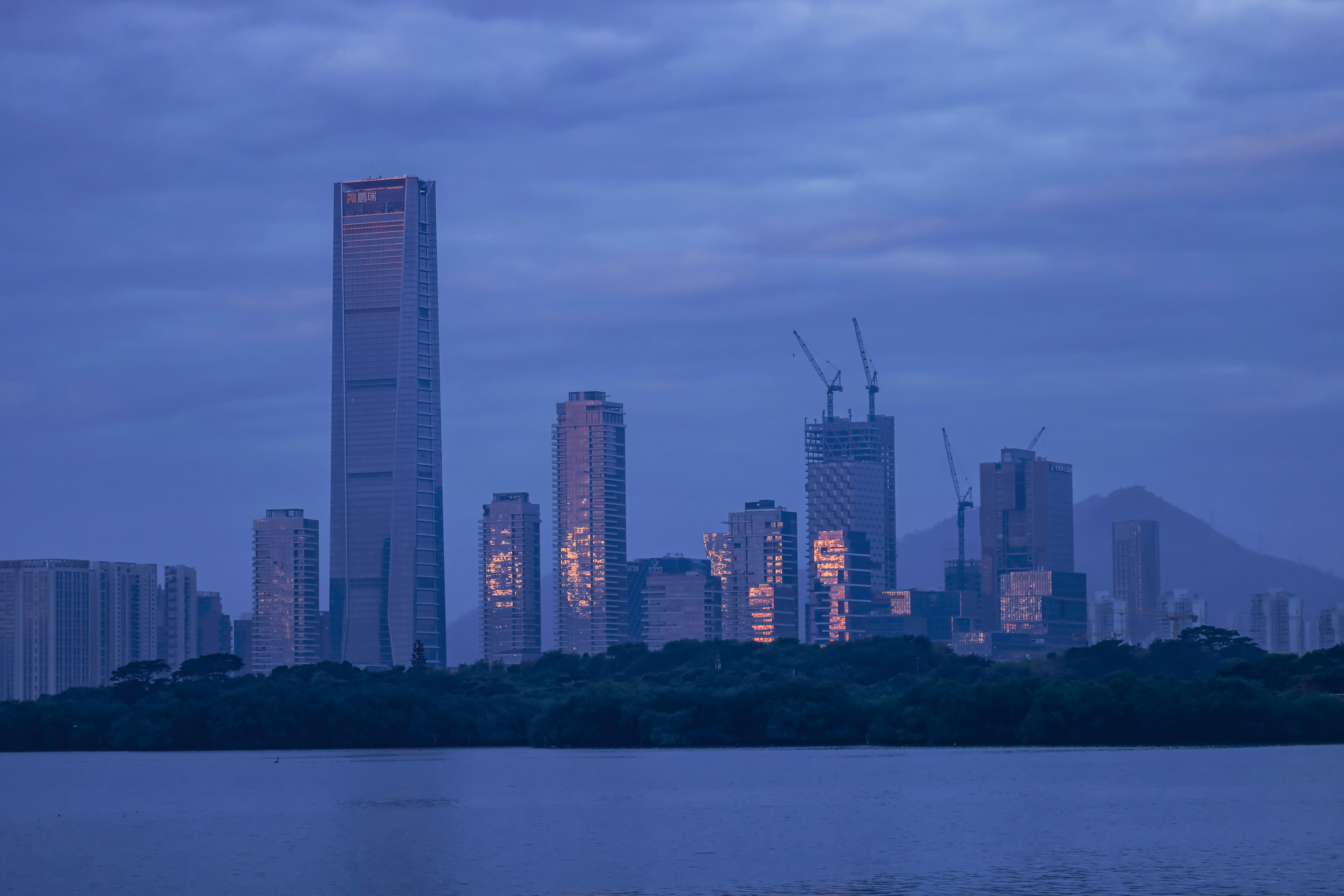 a view of a city skyline at dusk
