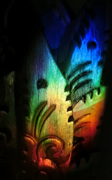 A vivid close-up of an advanced UV printing machine applying vibrant ink on a textured surface with colorful light reflections.