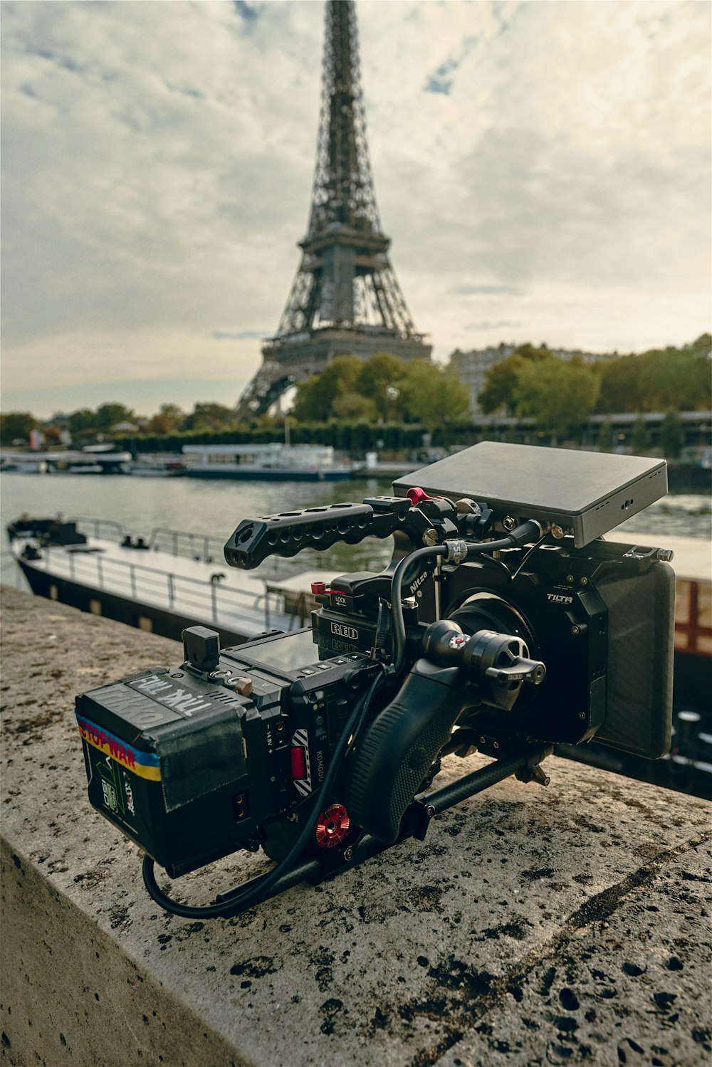 a camera set up in front of the eiffel tower