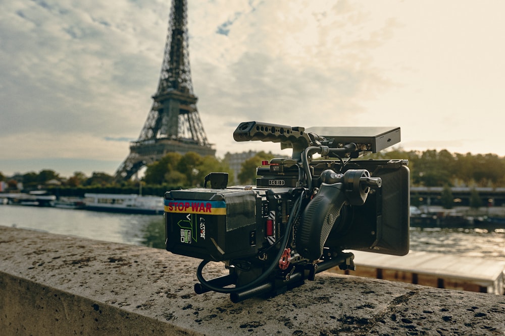 a camera set up in front of the eiffel tower