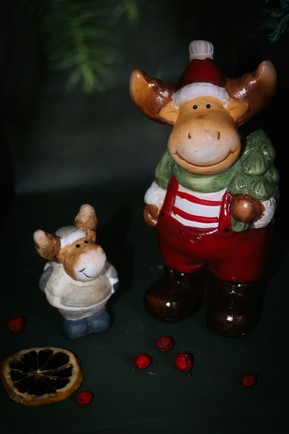 a ceramic figurine of a moose and a mouse