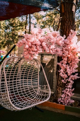 Vibrant hanging chair cushions displayed in a garden.
