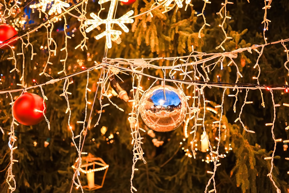 a christmas ornament hanging from a christmas tree