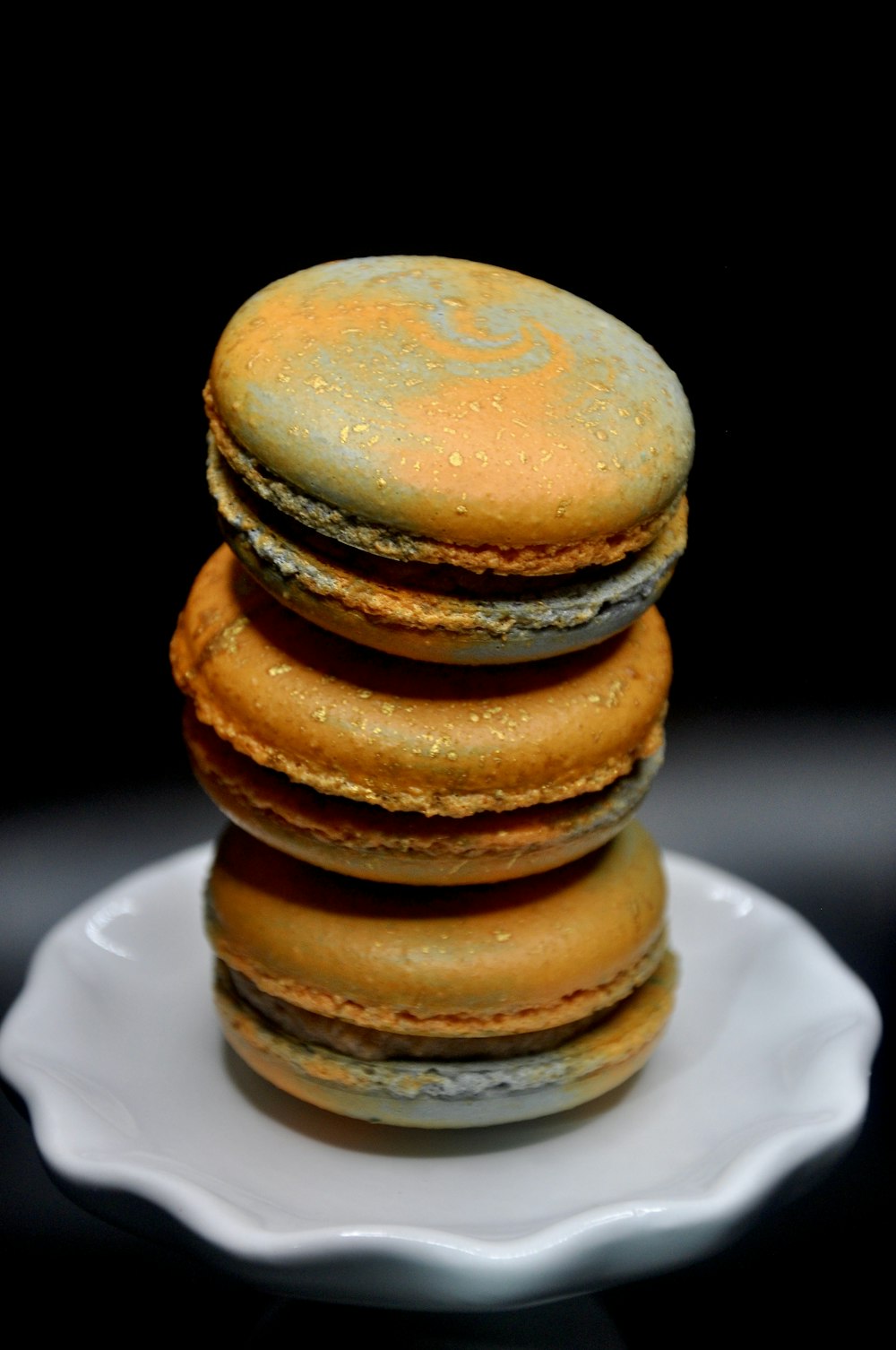 a stack of cookies sitting on top of a white plate