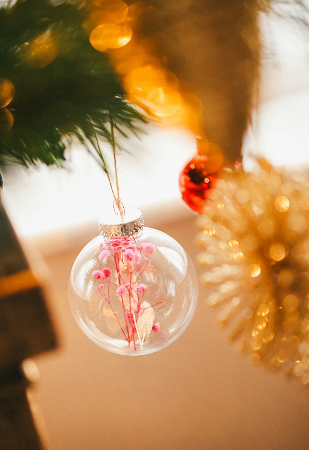 a christmas ornament hanging from a christmas tree