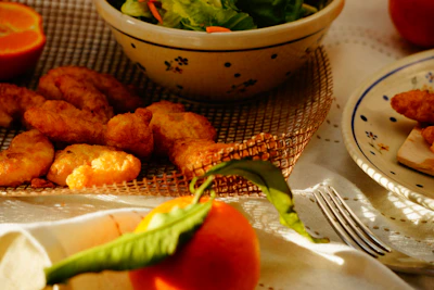 A warm, inviting photo of a juicy buttermilk chicken platter with fresh sides on a rustic wooden table.