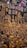 A vibrant collection of intricately crafted golden statues and religious artifacts, including various figures in meditative and symbolic poses. The display is densely packed with an assortment of sculptures, some featuring detailed engravings and colorful embellishments. On the backdrop, numerous framed artworks and decorative wall hangings complement the collection, adding texture and depth to the exhibit.