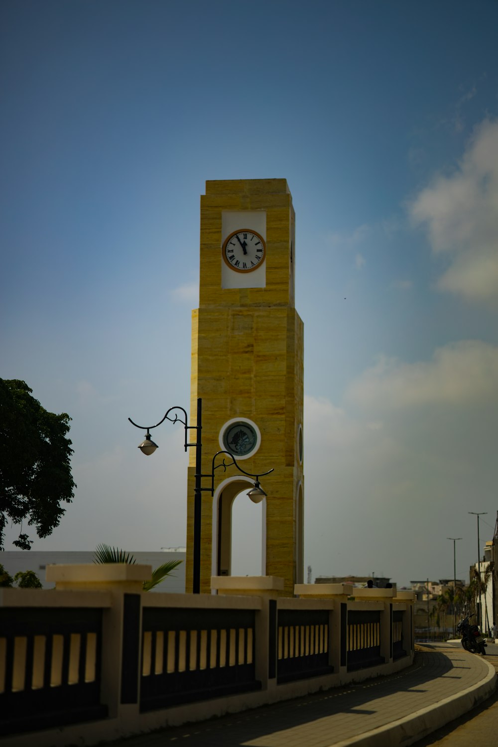 a tall clock tower with a clock on each of it's sides