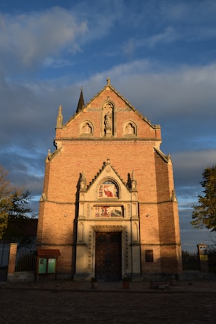 A charming historic church facade in Grottammare bathed in morning light.