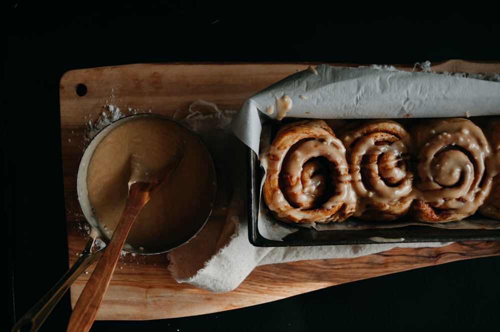 a wooden cutting board topped with lots of food