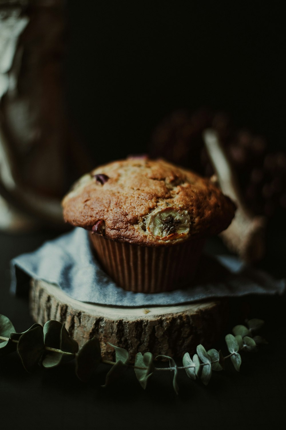 a muffin sitting on top of a piece of paper