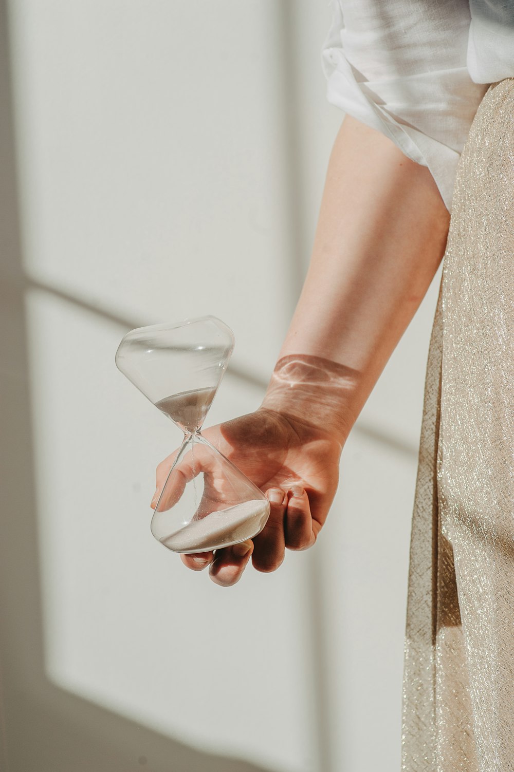 a woman holding a martini glass in her hand