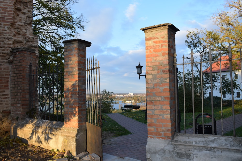 a brick building with a gate in front of it