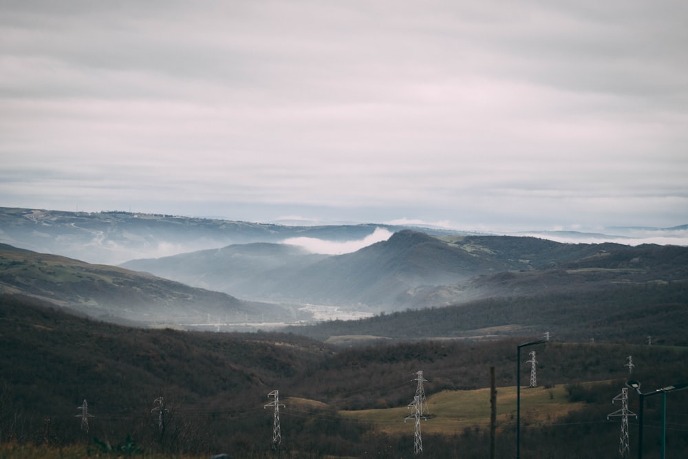 a view of a valley with mountains in the background