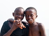 two young boys are posing for a picture
