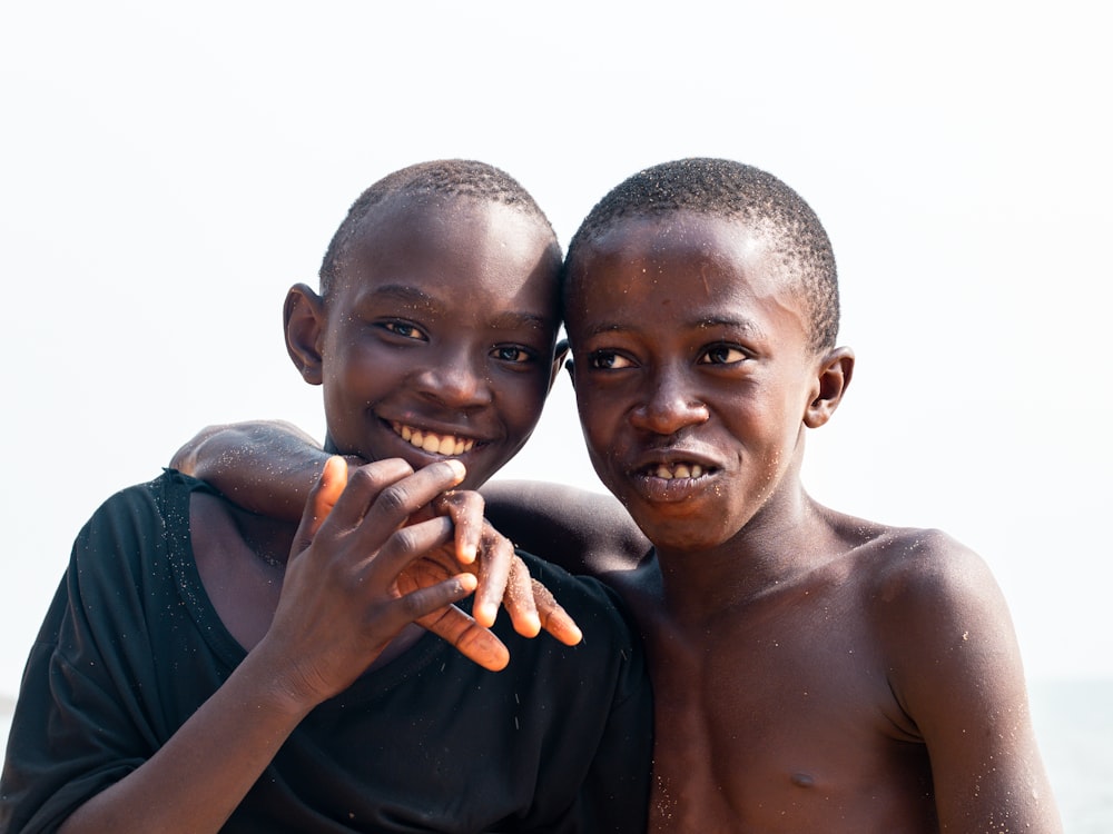 two young boys are posing for a picture