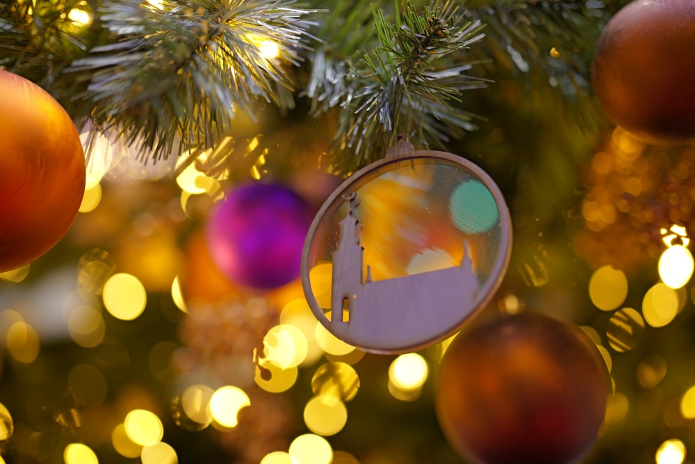 a christmas ornament hanging from a christmas tree