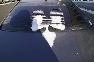 A user happily driving with a clear windshield after using Frostguard.